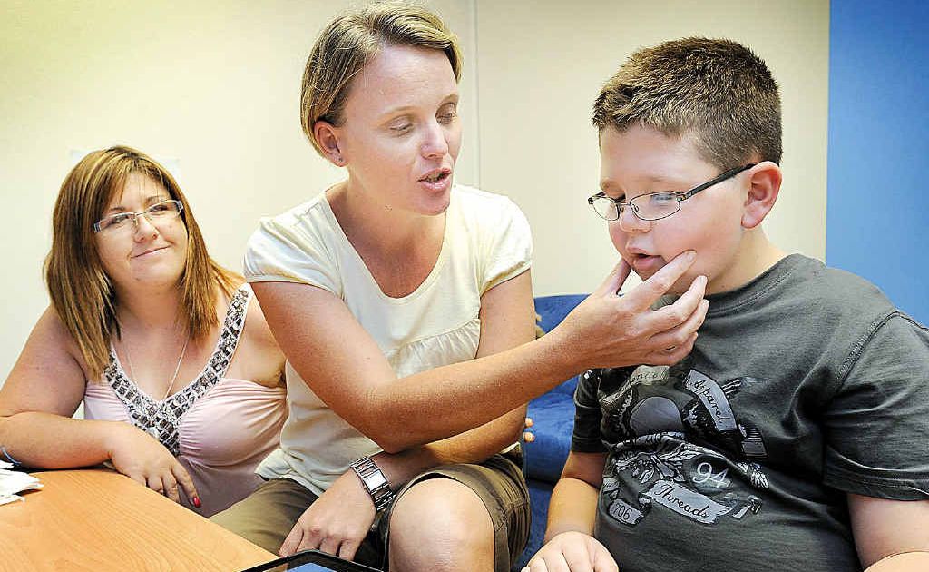 Kristy Gillespie and son Dylan, 9, with speech therapist Debbie Braund. Kristy Gillespie and son Dylan, 9, with speech therapist Debbie Braund.
